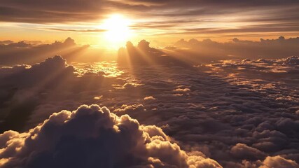 Aerial view of bright sun shining through dramatic clouds above a sea of white cumulus clouds at sunset 4k video - Powered by Adobe