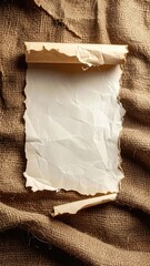 Crumpled scroll on rough brown cloth