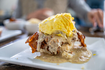 loaded biscuit with gravy