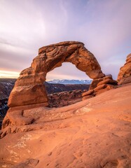 Natural rock arch at dawn landscape