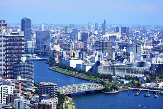 Aerial cityscape of Tokyo with Sumida River and modern skyline on a clear day