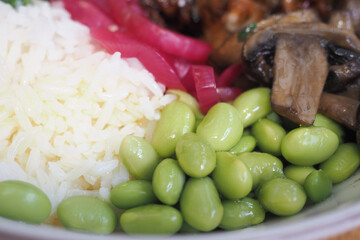 Colorful rice bowl with vegetables and protein served fresh