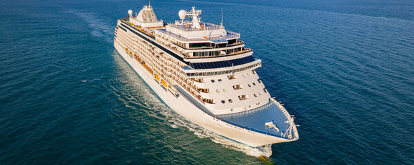 Cruise ships are sailing the seas, taking tourists on a journey around the world.