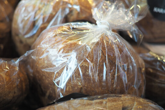 Freshly baked bread rolls in a packet displayed in a bakery bag