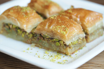 Delicious baklava served on a white plate for dessert