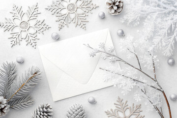 Winter holiday envelope with frosty decorations flat lay
