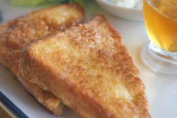 Crispy golden fried triangles served with refreshing drink