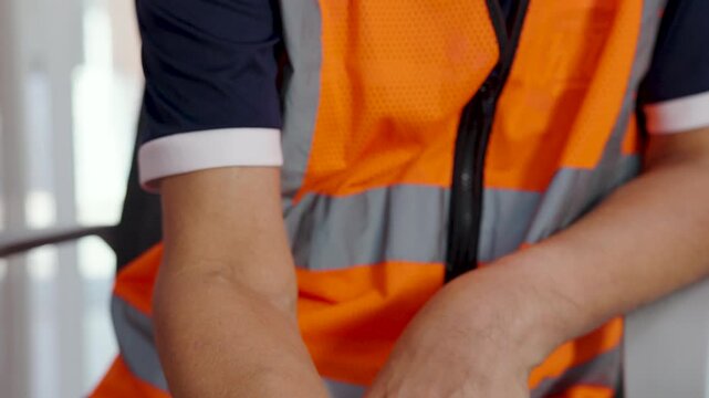 Close-up, Male worker uses wireless barcode reader to read barcode with red laser light to check the accuracy of barcode. Logistics, Import Export.