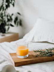 Orange Juice Glass on Wooden Tray in Bedroom