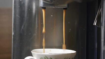 Perfect espresso brewing in a cozy kitchen setting
