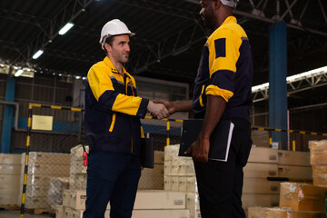 Group of diverse industrial factory workers shaking hands with deals.