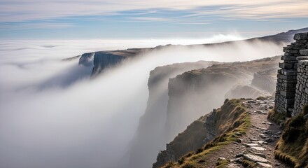 A scenic view of a cliffside path with stone walls, overlooking a sea of clouds. The landscape is dramatic with a moody atmosphere.