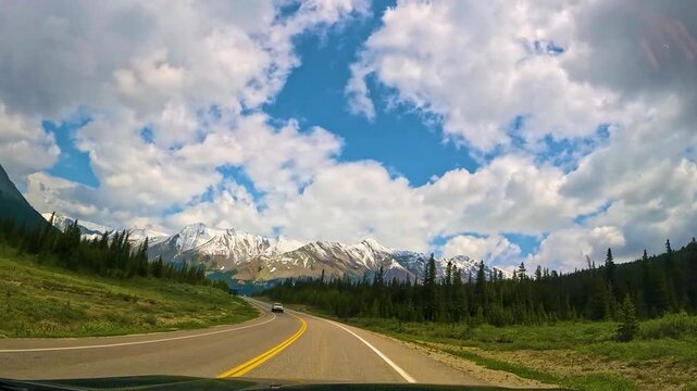 Drive along Icefields Parkway in Canada with mountain views on a clear day