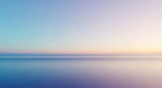 A serene, tranquil ocean with a gradient sky transitioning from blue to pink.