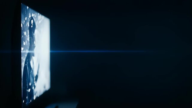Television Displaying Evolving Ry in Abstract and Dark Setting