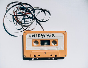 A vintage audio cassette tape labeled Holiday Mix