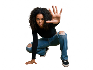 Young woman with curly hair crouching with hand raised in a stop gesture isolated on transparent background