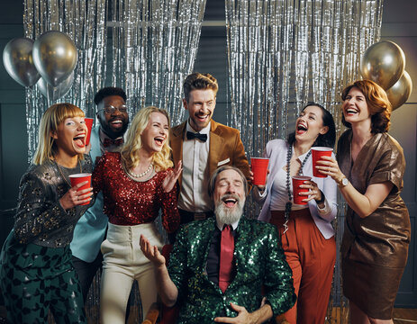 A candid flash photo of a retro 80s office Christmas party