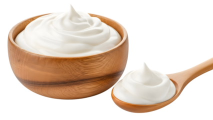Wooden bowl and spoon with swirls of white cream isolated on transparent background