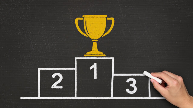 Business success concept, Businessman drawing podium and gold cup on chalkboard