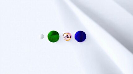 A minimalist composition featuring a row of colorful spheres arranged on a white surface with shadows. The spheres are green, iridescent, and blue.