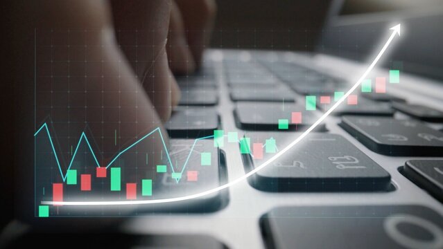 A close-up image showcasing hands typing on a laptop keyboard, with digital stock market graphs and charts overlaid, illustrating financial activity and growth trends. Copula - Powered by Adobe