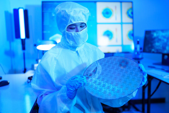 Technician working on analyzing semiconductor or microchip boards, electronics industry, electronic engineer, computer technology, CPU maintenance, hardware, motherboard component upgrades.	 - Powered by Adobe