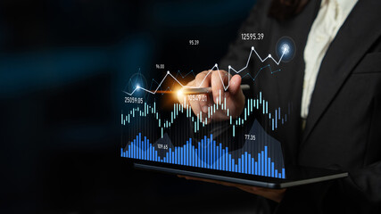 A business professional is engaged in financial analysis, using a laptop that displays vibrant graphs and statistics, highlighting market trends and growth strategies. Scalp