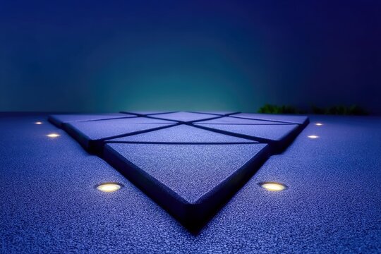 A low-angle shot of a geometric platform with embedded lights, set against a dark blue background. The platform is made of triangular tiles.