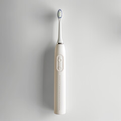 White electric toothbrush on grey background