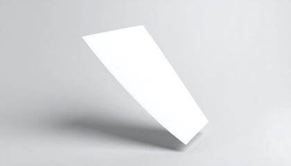 A stark white rectangle floats slightly tilted, casting a shadow below. Its clean surface suggests a blank canvas, minimalist design