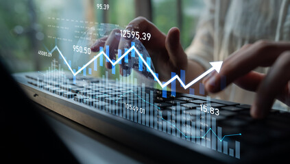 A businessperson engages with financial data on a laptop, showcasing various graphs and charts. The modern office setting highlights the importance of technology in financial analysis. Scalp