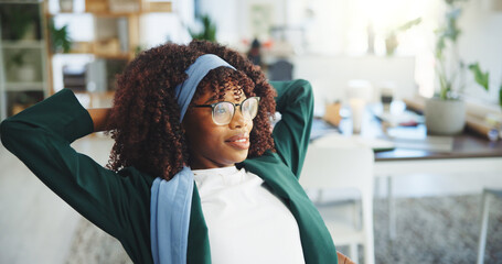 Business, African woman and relax in office for work break, productive day and complete tasks....