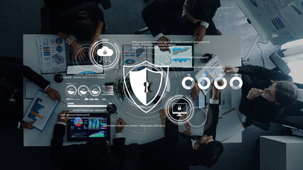A corporate team collaborates on cybersecurity strategies during a business meeting, analyzing data and graphs to enhance security and innovation efforts. Trope