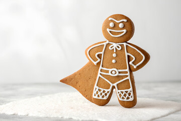 Funny superhero gingerbread cookie with icing cape
