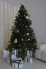 Christmas tree in the apartment interior.