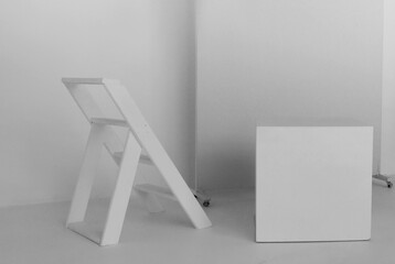 Minimalist photo studio interior with a small staircase.