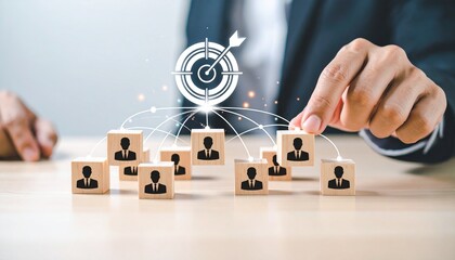 Businessperson interacting with people-icon blocks and digital target overlay on table