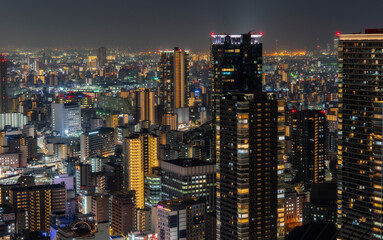 Fototapeta premium High angle view of illuminated buildings in Osaka city at night