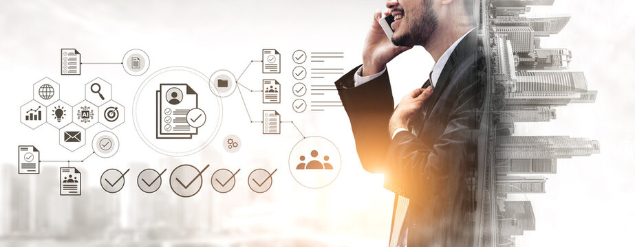 A businessman talking on a smartphone, surrounded by digital icons and urban skyline, representing modern job recruitment and professional networking in a dynamic industry. Gantry