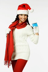Cheerful Woman in Santa Hat Holding Blank Gift Card