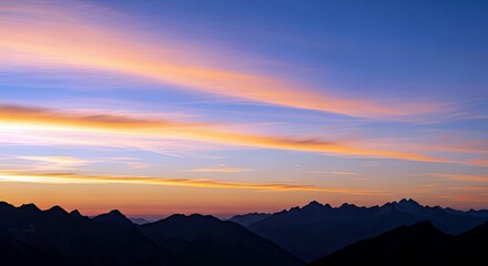 A scenic landscape featuring a silhouette of a mountain range under a vibrant sunset sky with shades of orange, pink, and blue.