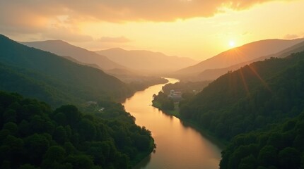 Golden sunset over a winding river valley with mountain silhouettes