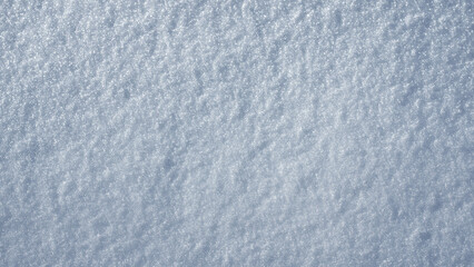 Snowy winter background with snow texture. Snow covered surface in daylight. Winter field pattern. Snow backdrop with natural frost details. Winter frozen texture with sparkling snow.