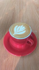 Coffe latte on the red cup photo,latte on the red cup stock photo,latte coffe on the red cup potrait,coffe late photo on the red cup stock photo 