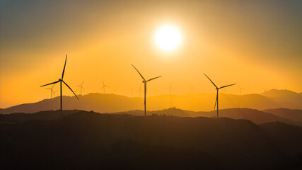 Panoramic view of wind farm or wind park, with high wind turbines for generation electricity with copy space. Green energy concept, Quang Tri, Vietnam