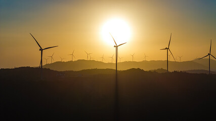 Panoramic view of wind farm or wind park, with high wind turbines for generation electricity with copy space. Green energy concept, Quang Tri, Vietnam