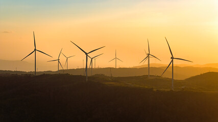Wind farm on the mountain, blue sky and white clouds, sun at Huong Linh, Quang Tri, Vietnam