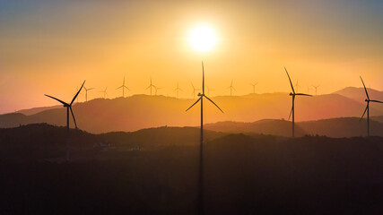 Wind farm on the mountain, blue sky and white clouds, sun at Huong Linh, Quang Tri, Vietnam