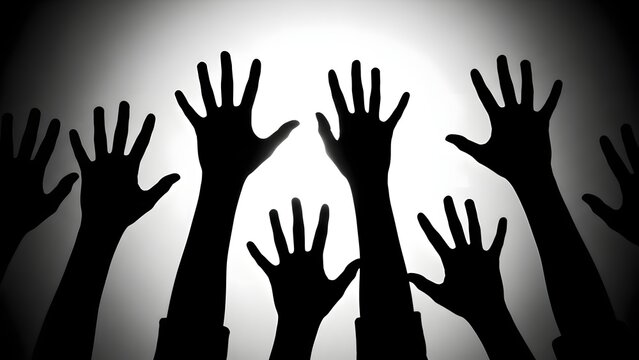 Silhouetted hands reaching upward in dark and light contrast